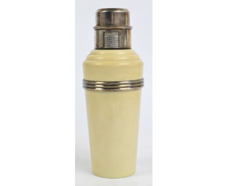 A 1930s Art Deco "The Master Incolor" cocktail shaker, cream bakelite with plated mounts, ribbed band and rotating cover deta