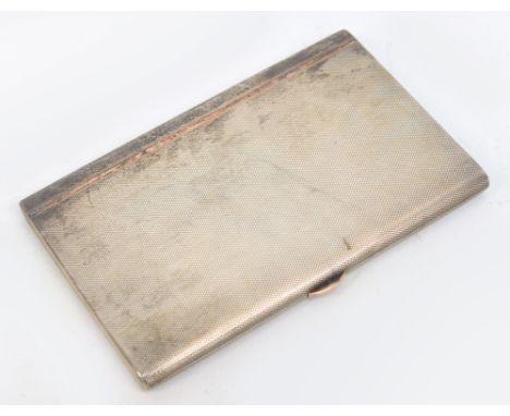 A George V hallmarked silver cigarette case of rectangular form with engine turned decoration, the interior inscribed "To Lio