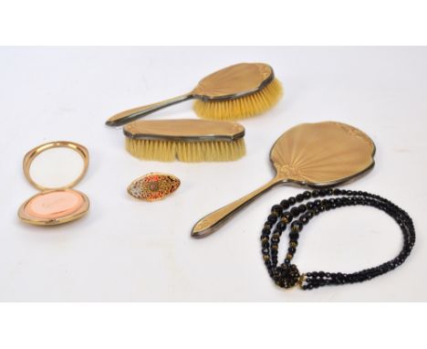 Three George V hallmarked silver and guilloche enamel backed dressing table items comprising hand mirror, hand brush, and clo