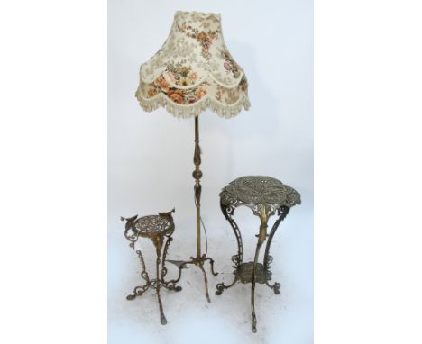 An early 20th century pierced brass two tier tripod jardinière stand, height 76cm, a smaller example, height 54cm, and a gilt