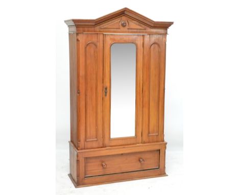 A late Victorian mahogany single mirror door wardrobe with drawer to base, width 118cm.