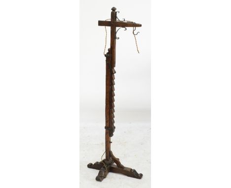 A reproduction oak Arts and Crafts style adjustable hangman's lamp with wrought iron mounts, height 136cm.