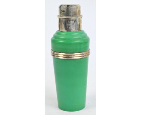 A 1930s Art Deco "The Master Incolor" cocktail shaker with green bakelite body and plated mounts, ribbed band and rotating ca
