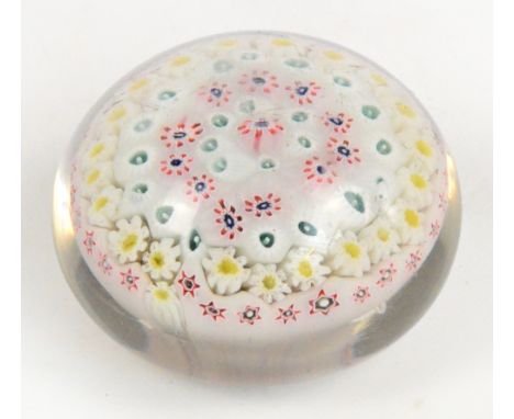 A mid 19th century Bacchus millefiori glass paperweight, diameter 7.5cm. CONDITION REPORT: There are five 'floating' pin head