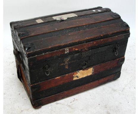 A metalbound domed travelling trunk.