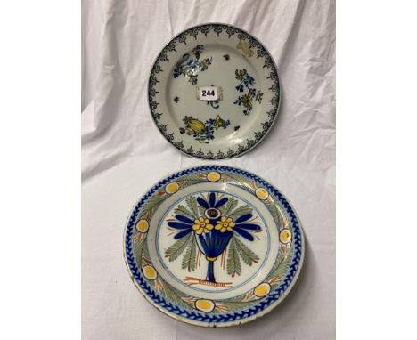 TWO DELFTWARE PLATES PAINTED WITH FLOWERS