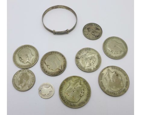 A collection of 1920 to 1946 silver coins and a child's silver bangle, 89g 