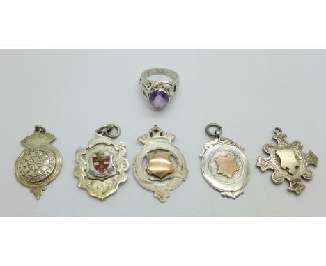 Five silver fobs including two with gold applied decoration and a silver ring, R 