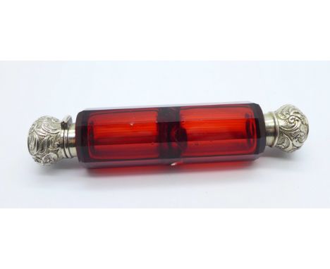 A silver mounted double ended ruby glass scent bottle, tests as silver 