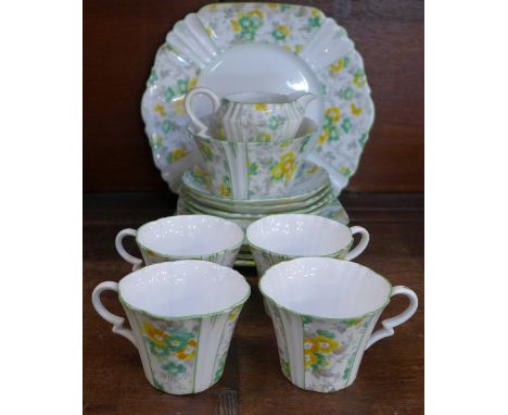 A 1930's Royal Albert tea service, four cups, saucers and side plates, a sandwich plate, cream and sugar, some a/f 