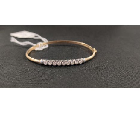 9 CARAT GOLD AND CZ BANGLE