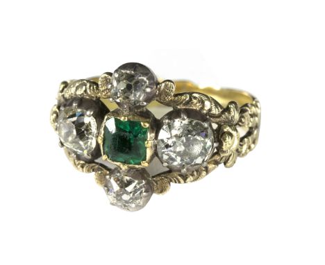 A Victorian emerald and diamond ring, the central square cut emerald flanked by old cut diamonds to each side and to each sho