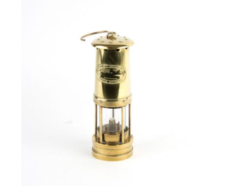 An E Thomas & Williams Ltd. miners lamp, Cambrian type and a set of postage scales