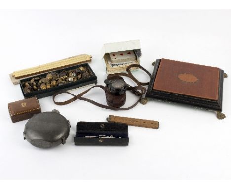 A collection of military badges and buttons,a military compass 'V. ST. G. T. Connolly R M', a pewter water bottle, a slide ru