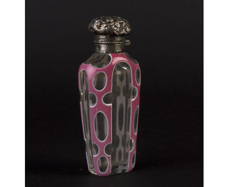 A glass and pink enamel scent bottle with embossed silver cover, 10.5cm high/Provenance: Treago Castle, Herefordshire Conditi