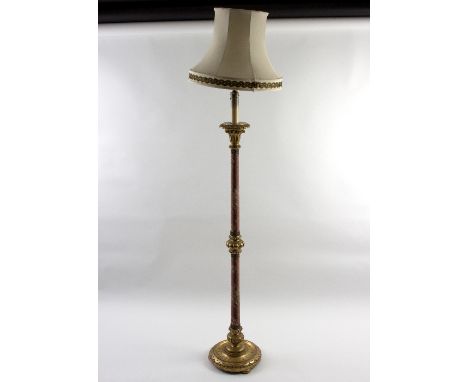 A gilded and material covered lamp, 189cm high/Provenance: The Down House, Redmarley