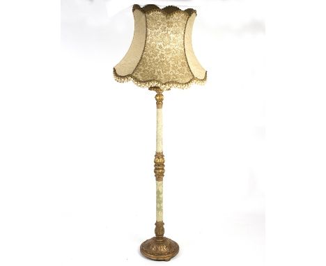 A gilded and material covered standard lamp, 187cm high/Provenance: The Down House, Redmarley