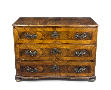 A late 18th Century Austrian walnut commode, fitted three drawers with waved front, veneered with decorative panels and inter