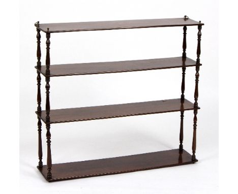 A mahogany hanging shelf with spindle turned supports, 80cm wide