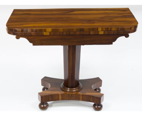 A Victorian rosewood foldover card table on octagonal column and platform base, 91.5cm wide