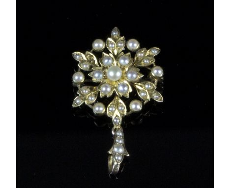 A seed pearl pendant/brooch of flowerhead form with removable bail   Condition Report:  There is a pearl missing from one of 
