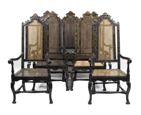 A set of William and Mary black and gilt japanned furniture, comprising a three-seat settee and four open armchairs decorated