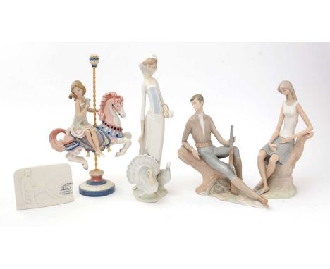 A Lladro figure of a girl riding a carousel horse; a Lladro figure of a girl with turkeys; a Lladro figure of a seated girl w