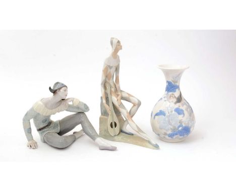 A Lladro figure entitled Utopia, 34cms; a Nao Harlequin figure, 36cms, and Lladro baluster vase with moulded decoration, 26cm