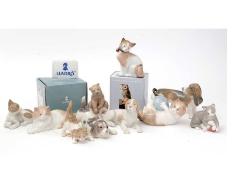 Four Lladro porcelain animal figures including; cats, dogs, puppy, owl, two examples boxed; together with five Nao porcelain 