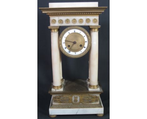 FRENCH 19TH CENTURY GILT METAL AND ALABASTER TWO TRAIN PORTICO CLOCK in Romanesque style having white enamel Roman chapter ri