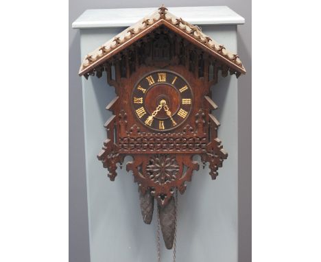 LATE 19TH CENTURY BAVARIAN GOTHIC DESIGN HANGING CUCKOO CLOCK having Roman numerals, automaton cuckoo and pendulum driven mov