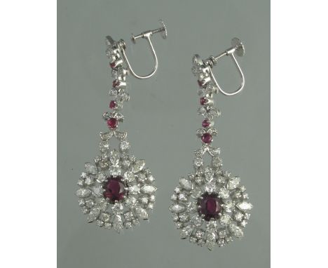 A PAIR OF RUBY AND DIAMOND DROP EARRINGS. Length of drop 5.5cm approx. Weight 18.1g approx. (B.P. 24% incl. VAT) CONDITION RE
