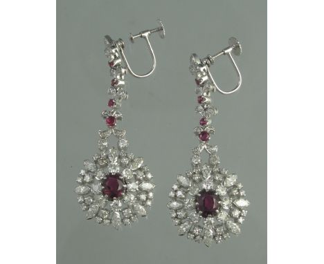 A PAIR OF RUBY AND DIAMOND DROP EARRINGS. Length of drop 5.5cm approx. Weight 18.1g approx. (B.P. 24% incl. VAT) CONDITION RE