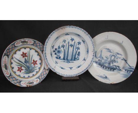 GROUP OF THREE 18TH CENTURY DELFTWARE TIN GLAZED PLATES, two with underglaze blue decoration, the third polychrome decorated,