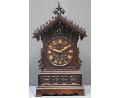 19TH CENTURY BAVARIAN STAINED GOTHIC DESIGN TWO TRAIN AUTOMATON MANTEL CLOCK the case overall with carved and moulded decorat