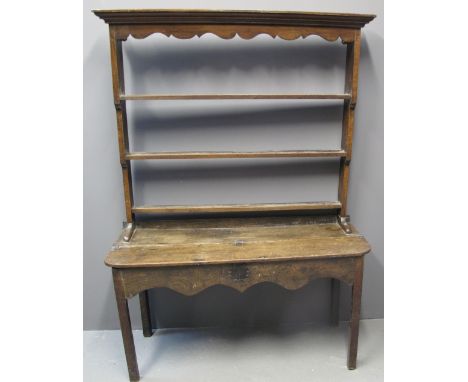 UNUSUAL SMALL OAK DRESSER with open three shelf rackback, the base with hinged surface revealing two compartments to the inte