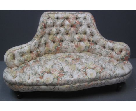 SMALL UPHOLSTERED LOW TWO SEATER BUTTON BANKED TRIANGULAR SHAPED CONVERSATION SOFA with floral upholstery on vase shaped legs