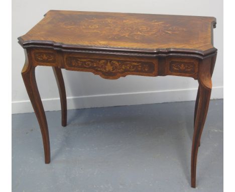 19TH CENTURY FRENCH DESIGN BREAK FRONTED INLAID KINGWOOD AND WALNUT FOLD OVER CARD TABLE overall decorated with foliate inlai