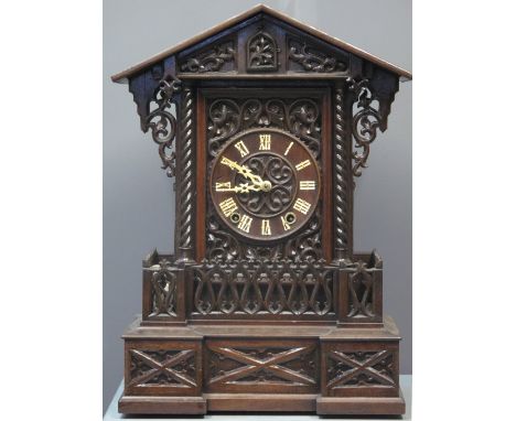 LATE 19TH CENTURY BAVARIAN GOTHIC DESIGN TWO TRAIN AUTOMATON CUCKOO CLOCK case overall with foliate and geometric moulded dec