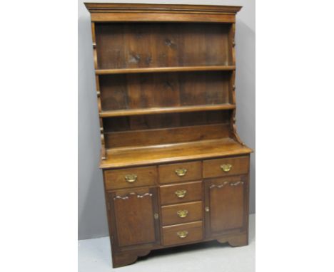 SMALL RECONSTRUCTED WELSH OAK DRESSER having two shelf boarded rackback over projecting base with moulded edge, three frieze 