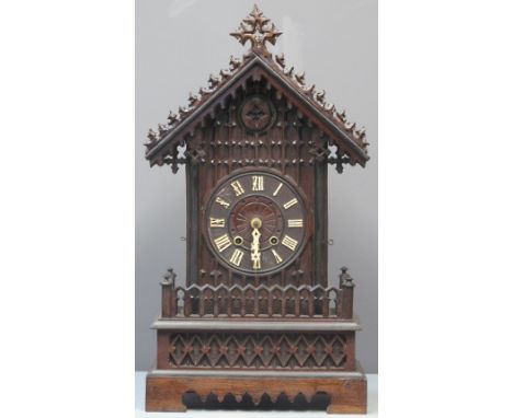 LATE 19TH CENTURY BAVARIAN STAINED OAK GOTHIC DESIGN TWO TRAIN MUSICAL CUCKOO CLOCK the case with arcaded Medieval design geo