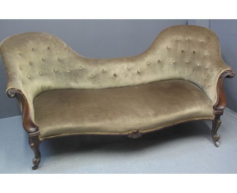 VICTORIAN MAHOGANY SHOW FRAME DOUBLE ENDED SOFA having buttoned back and serpentine stuff over seat, foliate moulded scroll a