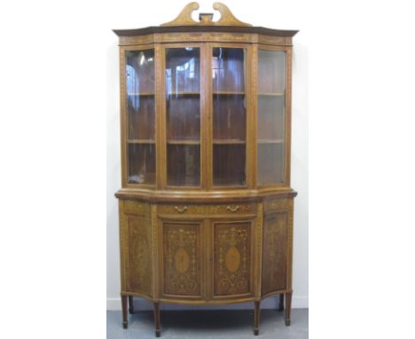 LATE VICTORIAN EDWARDS & ROBERTS INLAID MAHOGANY BOW FRONTED CABINET having broken swan neck pediment over glazed cabinet wit