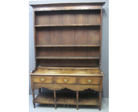 19TH CENTURY WELSH OAK POTBOARD DRESSER having three shelf boarded rack back under swept cornice, the base with moulded edge 
