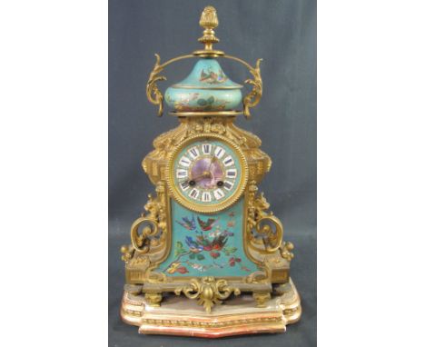 19TH CENTURY FRENCH ORMOLU TWO TRAIN MANTEL CLOCK in classical design with porcelain urn shaped pediment over scroll mounted 