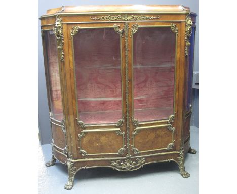 FINE 19TH CENTURY FRENCH WALNUT STRAIGHT FRONTED DISPLAY CABINET having swept top, above a pair of glazed doors with foliate 