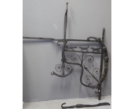 UNUSUAL WROUGHT IRON RANGE SIDE KETTLE ENGINE the adjustable mechanism decorated with hounds chasing fox. 90cm high, 12cm lon