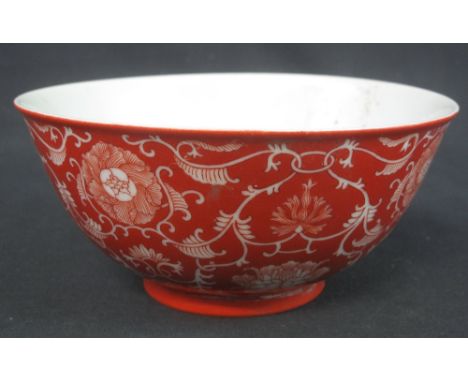 CHINESE PORCELAIN FOOTED BOWL, overall decorated with peony and lotus heads amongst Classical scroll work, in overglazed iron