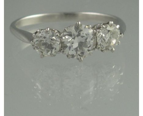 A THREE STONE DIAMOND RING. The brilliant cut diamonds an estimated total diamond weight of 1.75cts. Ring size R &amp; 1/2, w