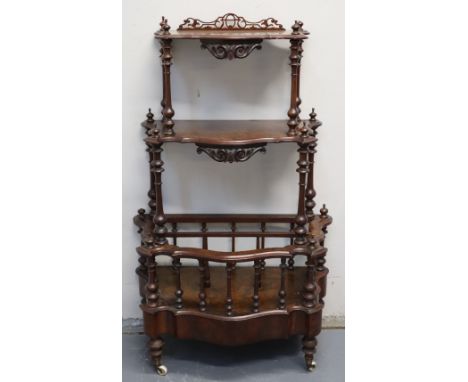 VICTORIAN WALNUT SERPENTINE FRONTED MUSIC STAND WHATNOT having pierced and scrolled mounts, baluster turned tapering uprights